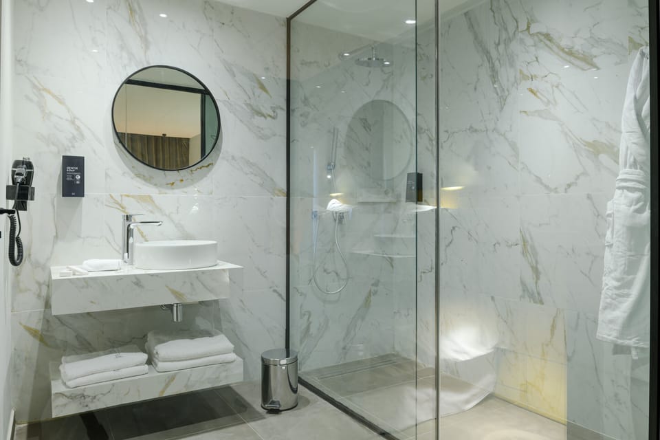 Shower, rainfall showerhead, designer toiletries, hair dryer