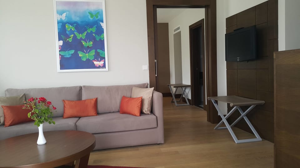 Family Suite | Living area | Flat-screen TV