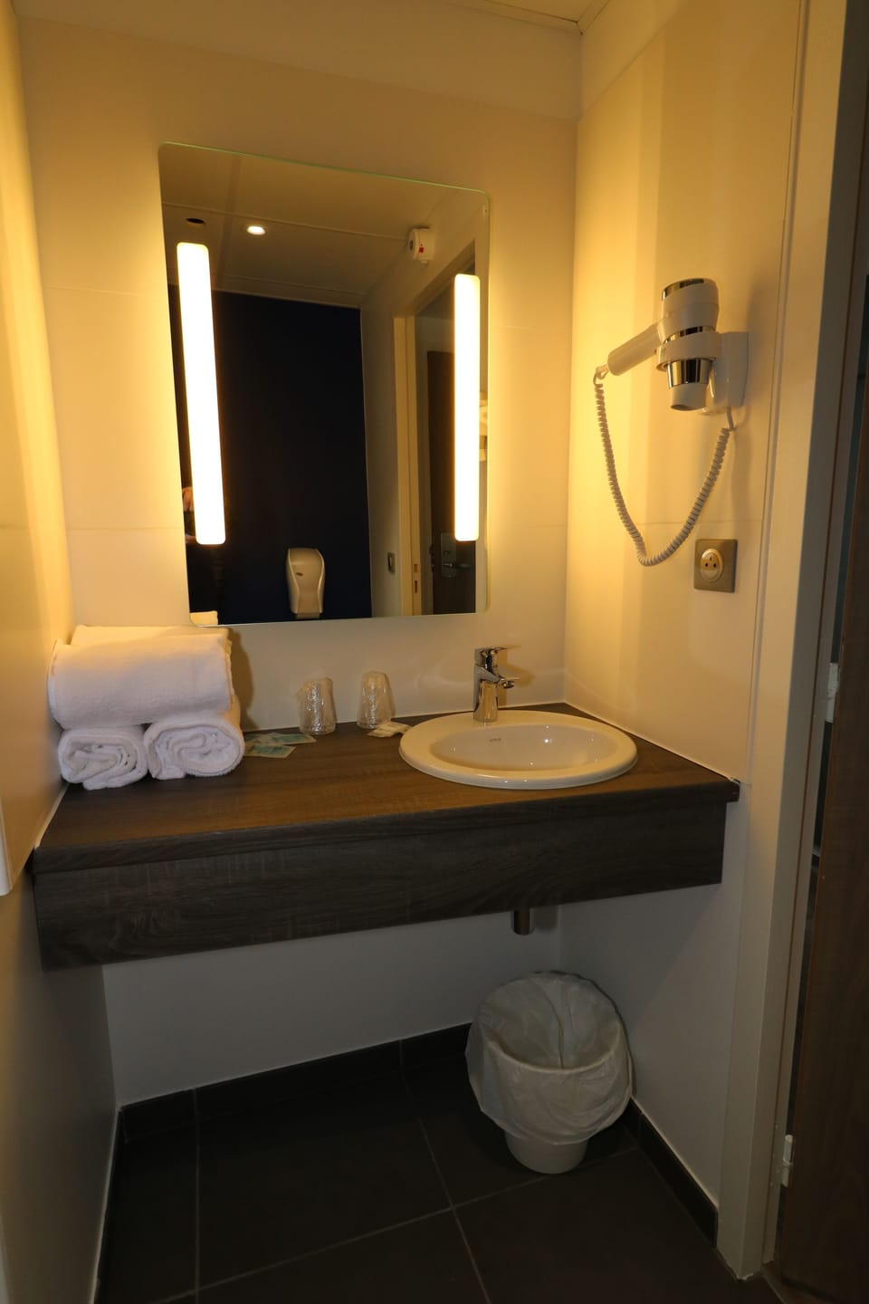 Shower, rainfall showerhead, hair dryer, towels
