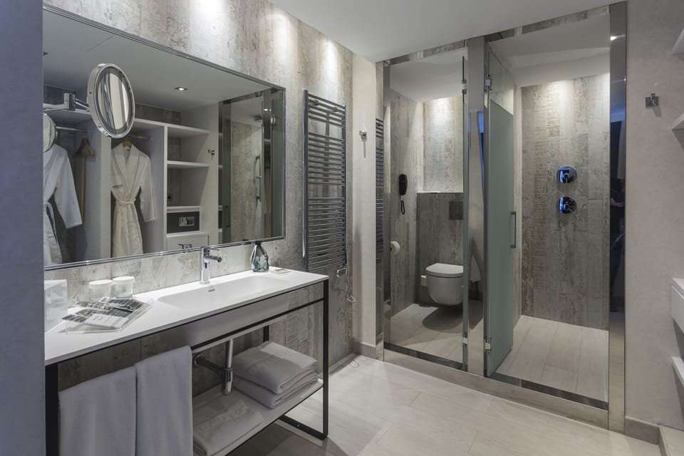 Shower, eco-friendly toiletries, hair dryer, bathrobes