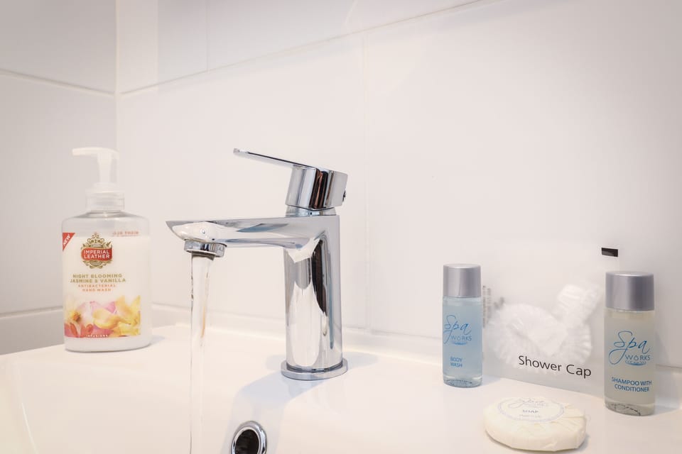 Double Room (3rd floor, rooftop view) | Bathroom | Shower, free toiletries, hair dryer, towels