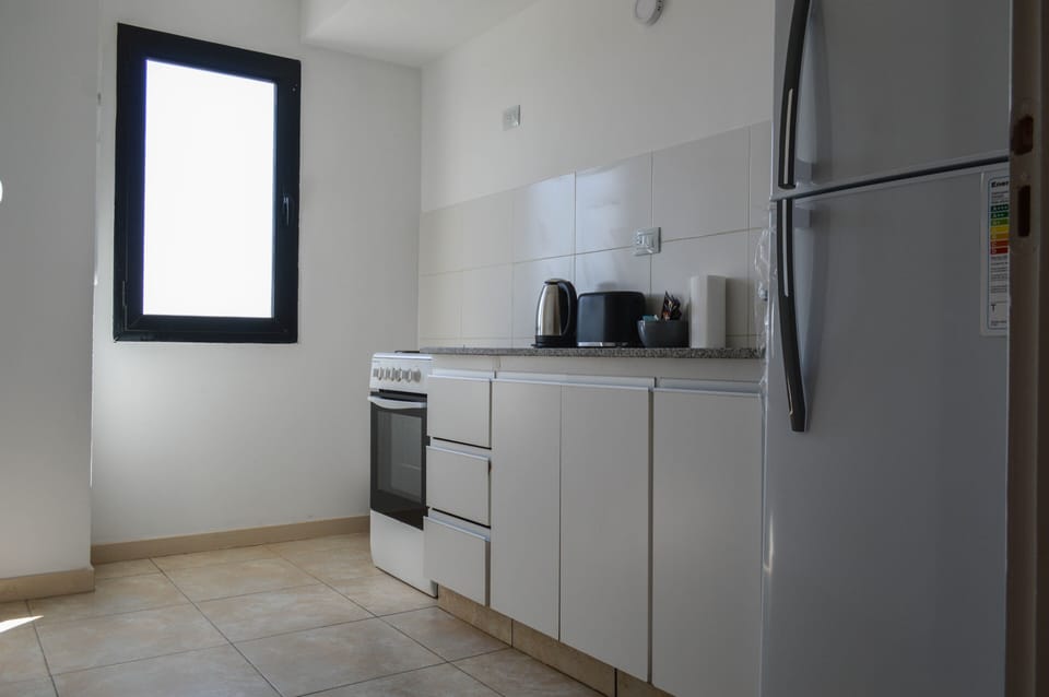 Apartment, 2 Bedrooms | Private kitchen | Fridge, microwave, stovetop, coffee/tea maker