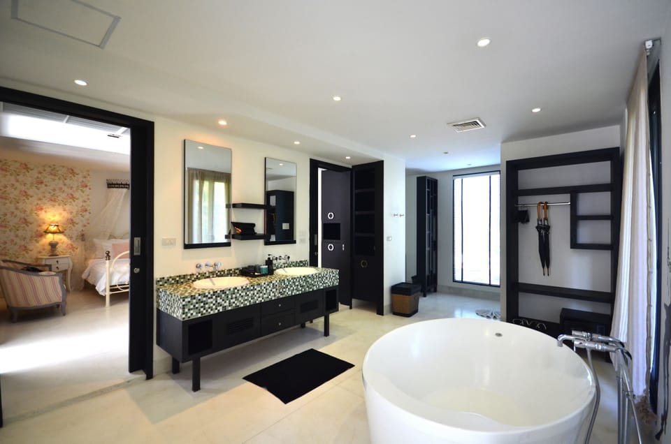 Shower, hair dryer, slippers, towels