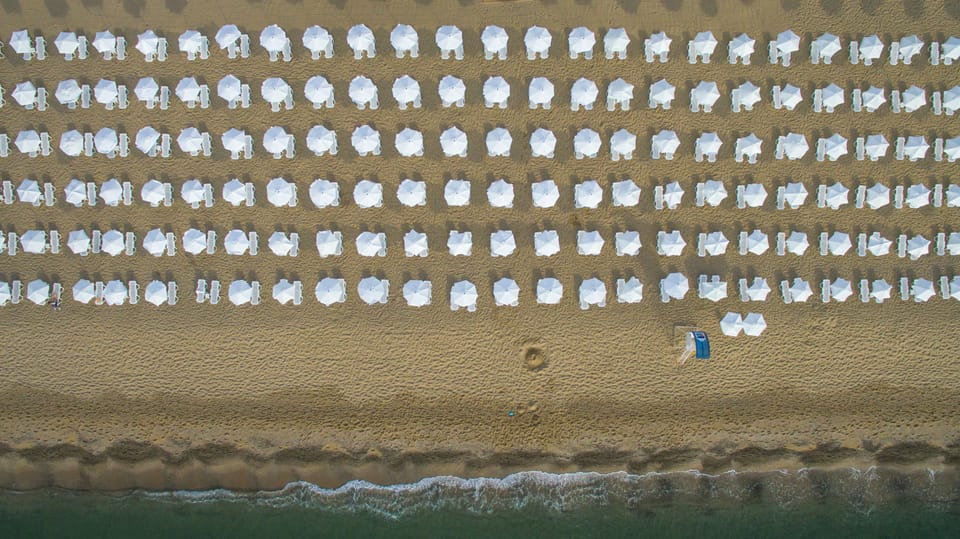 On the beach, sun loungers, beach umbrellas, beach towels