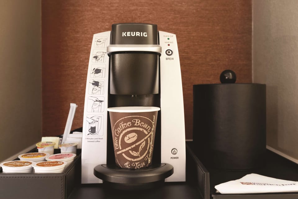 Desk, laptop workspace, blackout drapes, iron/ironing board