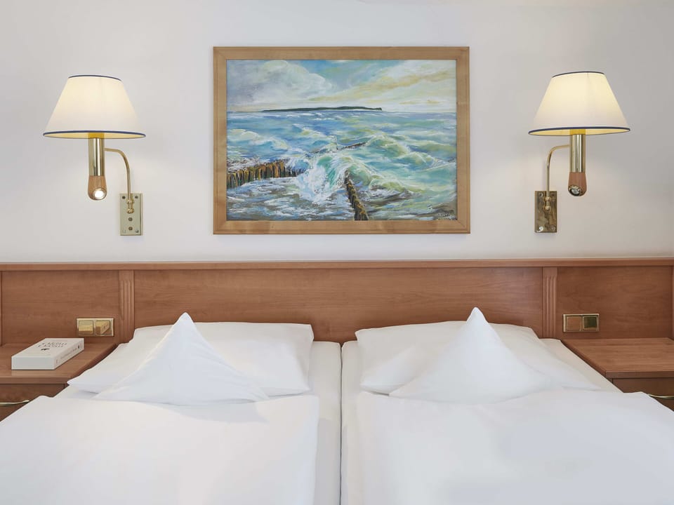 Hypo-allergenic bedding available, minibar, in-room safe