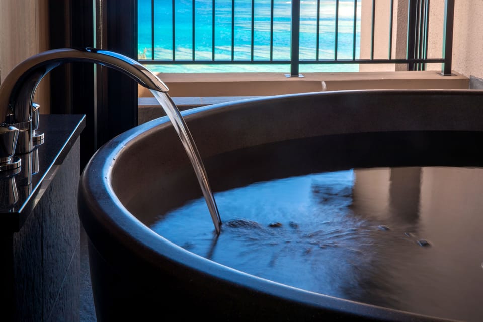 Premium Suite | Bathroom | Combined shower/tub, deep soaking tub, designer toiletries, hair dryer