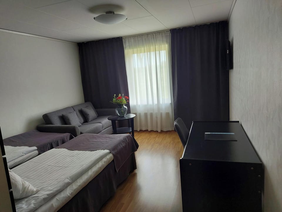 Economy Double Room | Desk, blackout drapes, iron/ironing board (on request), WiFi (free)