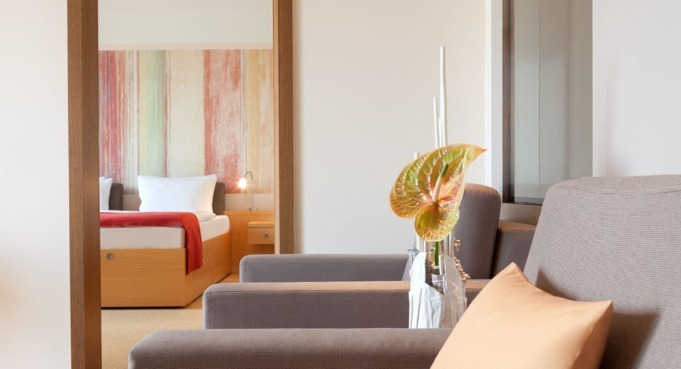 Deluxe Suite, Sea View | Hypo-allergenic bedding, free minibar, in-room safe, desk