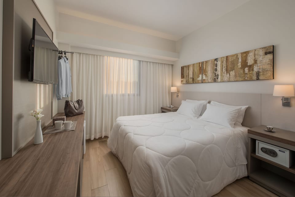 Superior Double Room | Minibar, in-room safe, desk, laptop workspace