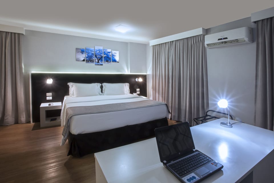 Superior Double Room | Minibar, in-room safe, desk, blackout drapes