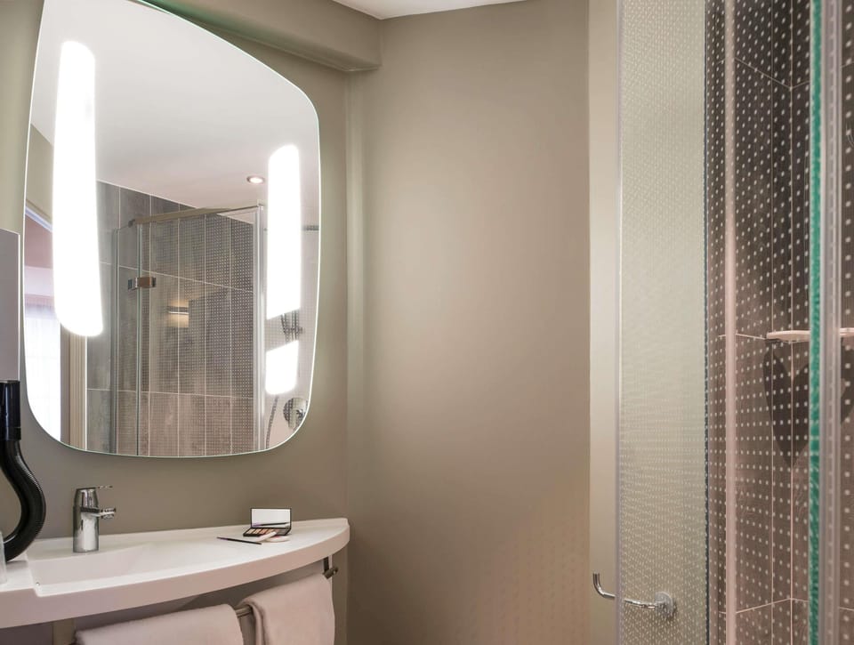 Shower, eco-friendly toiletries, hair dryer, towels