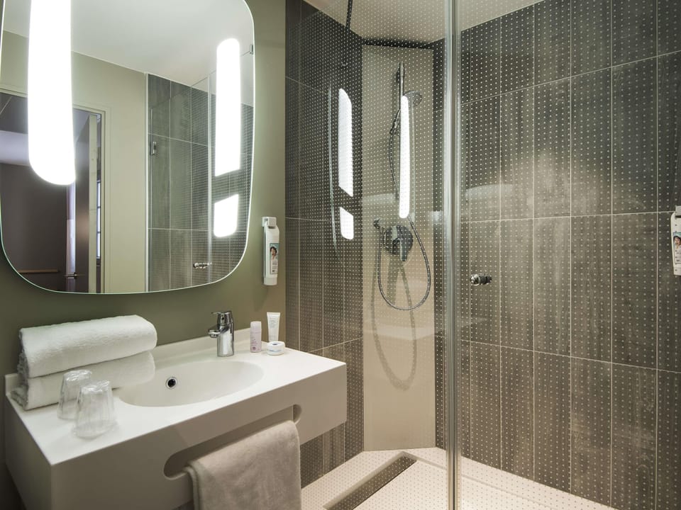Shower, eco-friendly toiletries, hair dryer, towels