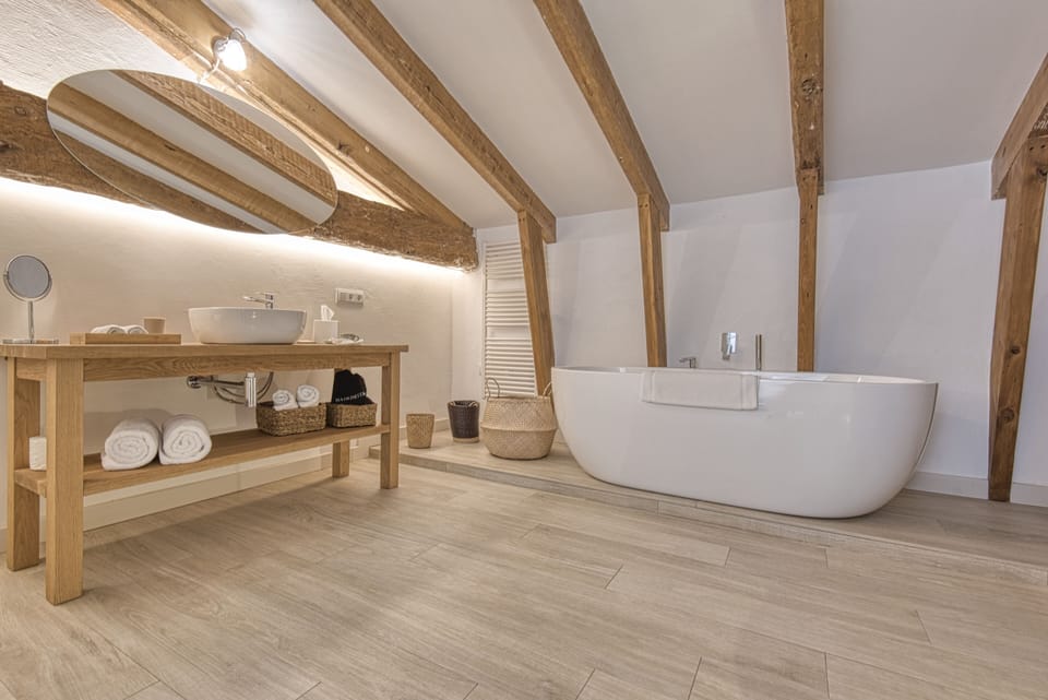 Deluxe | Bathroom | Rainfall showerhead, free toiletries, hair dryer, bathrobes