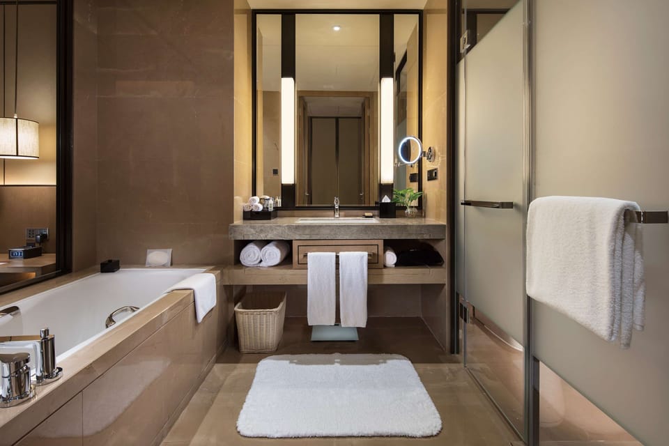 King Premium Suite-Panorama Bay View | Bathroom | Separate tub and shower, deep soaking tub, rainfall showerhead