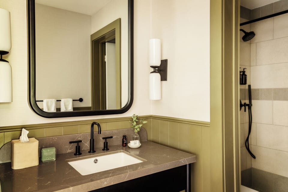 Shower, designer toiletries, hair dryer, towels