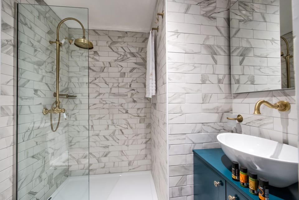 Superior Room, City View (Maisonette) | Bathroom | Shower, free toiletries, hair dryer, bathrobes