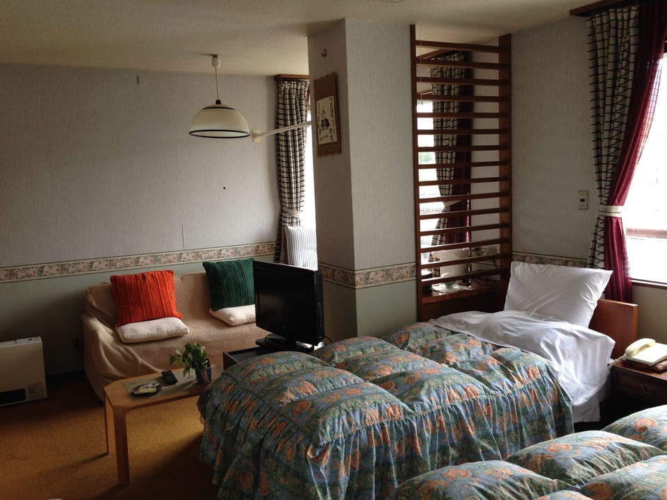 Western Style Room with Private Bathroom, Non Smoking | Minibar, desk, free WiFi, bed sheets