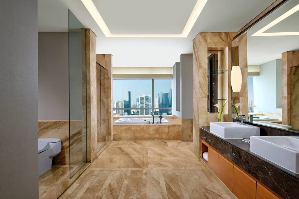 Separate tub and shower, designer toiletries, hair dryer, bathrobes