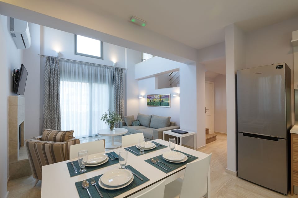 Eco Villa Complex | Living area | 50-inch flat-screen TV with satellite channels, Smart TV, Netflix
