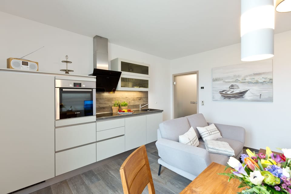 Apartment, 1 Bedroom | Living area | 32-inch TV with satellite channels, fireplace, DVD player