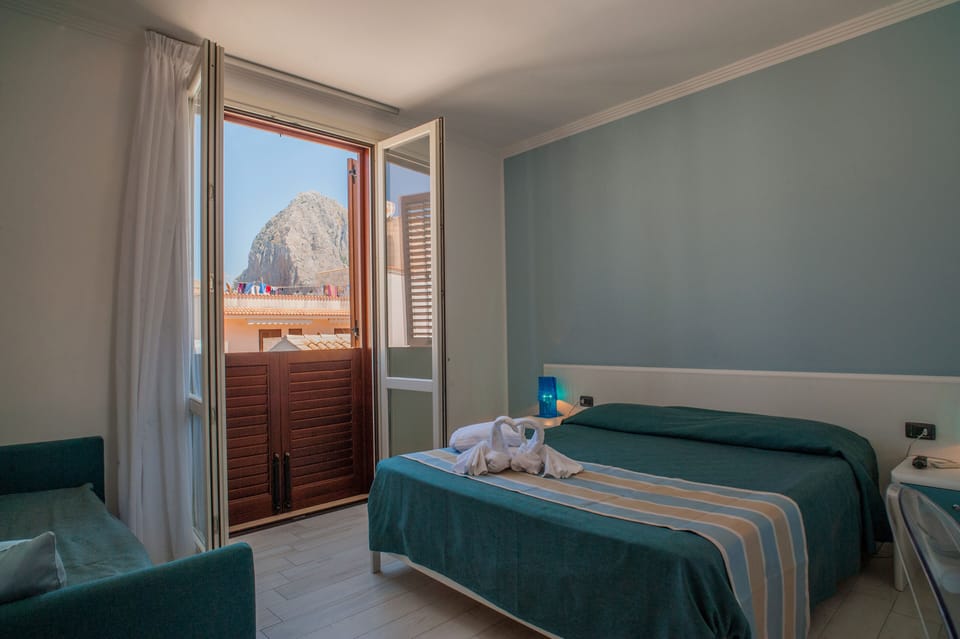 Panoramic Triple Room, Hill View | Minibar, in-room safe, desk, soundproofing