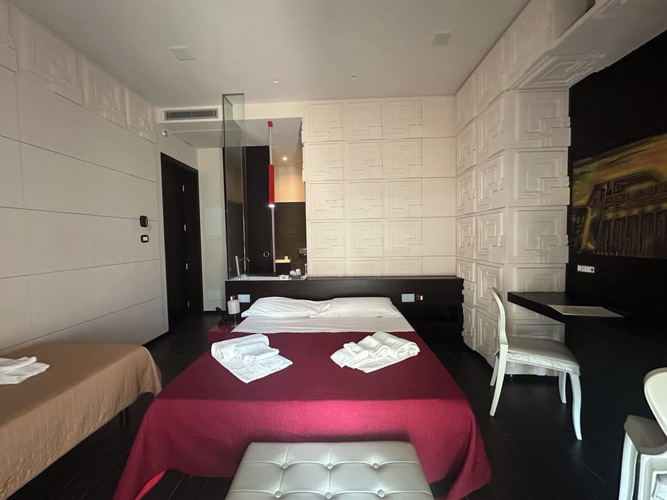 Premium bedding, down comforters, in-room safe, desk