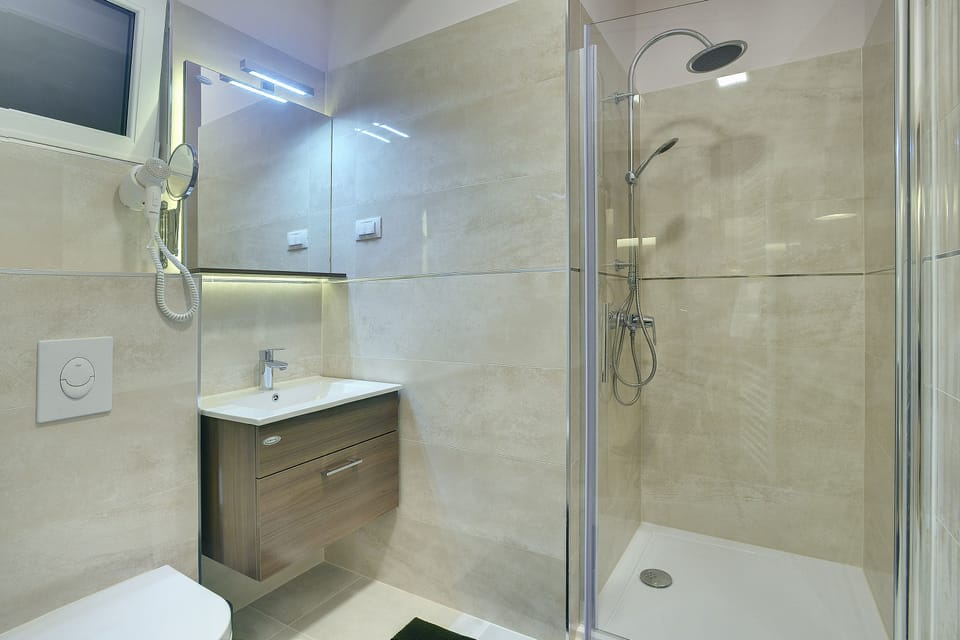 Shower, free toiletries, hair dryer, slippers
