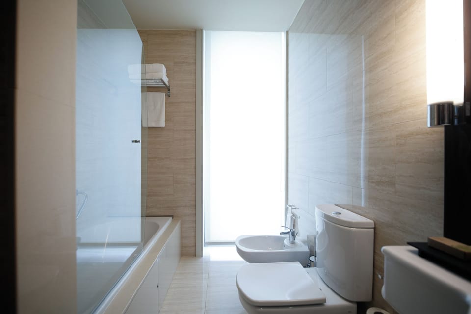 Designer toiletries, hair dryer, bidet, towels