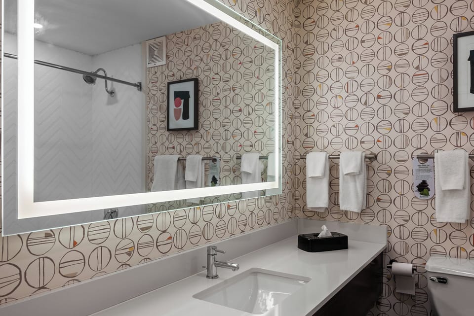 Desk, laptop workspace, blackout drapes, iron/ironing board