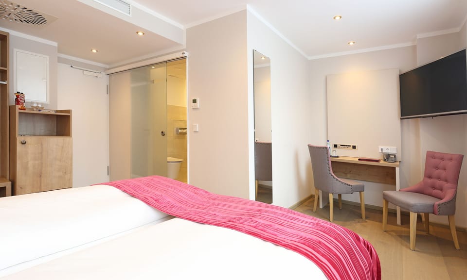 Standard Double Room Plus (street side) | Hypo-allergenic bedding, minibar, in-room safe, individually decorated
