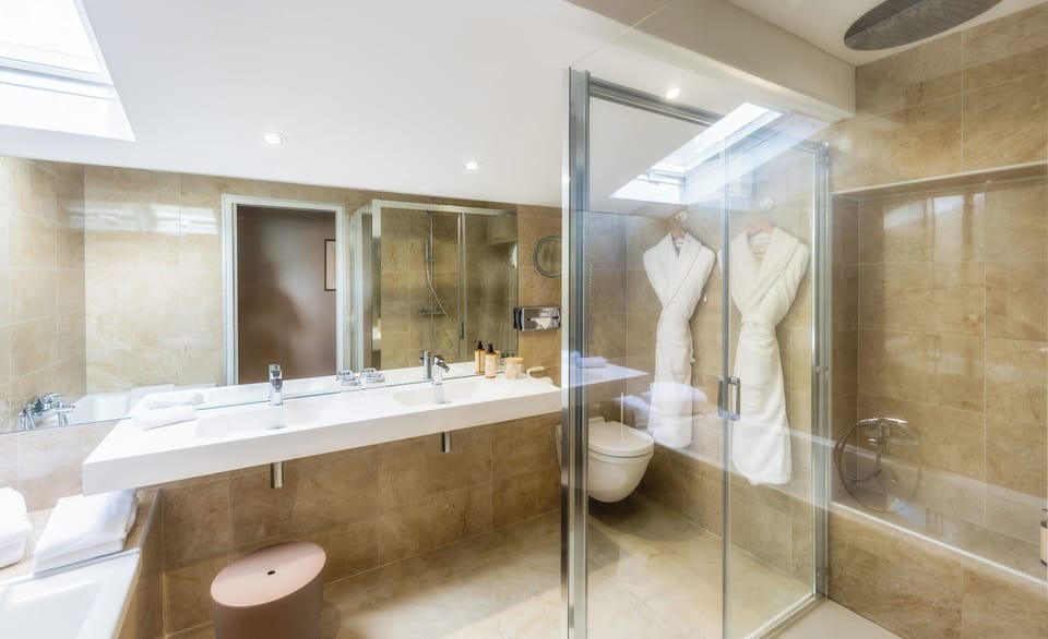 Separate tub and shower, eco-friendly toiletries, hair dryer, bathrobes