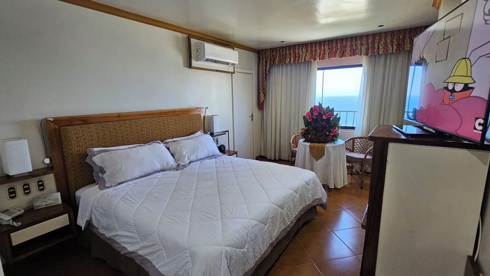 Deluxe Suite, Ocean View | Premium bedding, in-room safe, desk, laptop workspace
