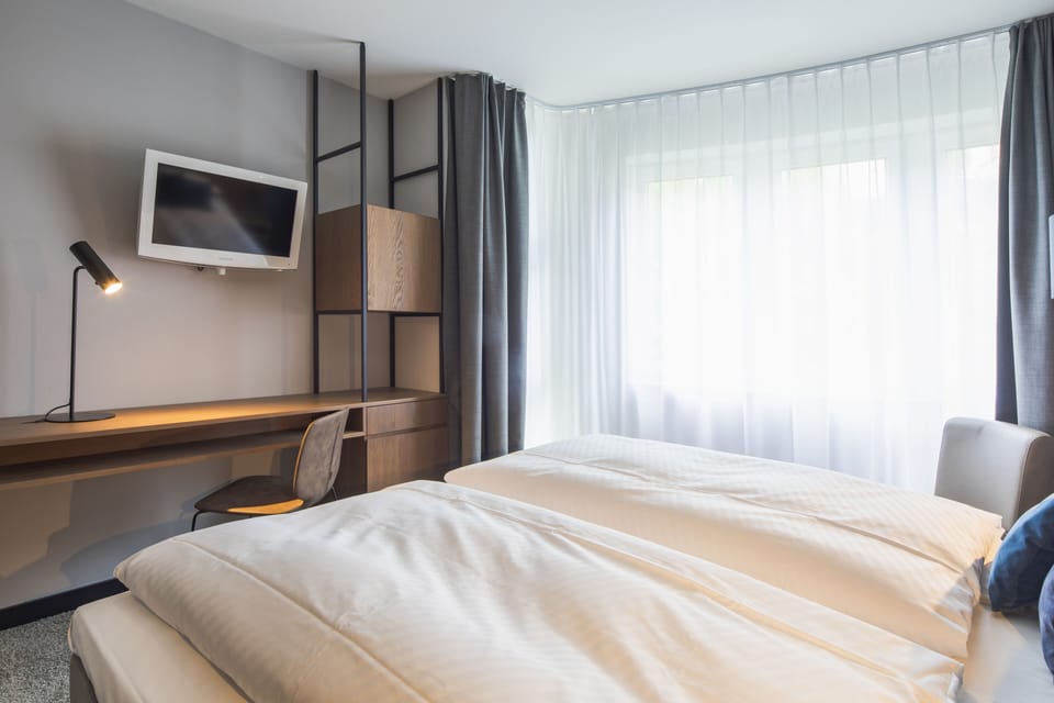 Double Room, River View | In-room safe, desk, laptop workspace, blackout drapes