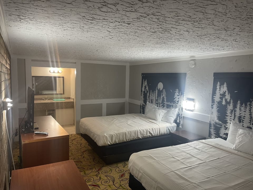 Standard Room, 2 Queen Beds, Non Smoking, Jetted Tub | Desk, blackout drapes, soundproofing, iron/ironing board