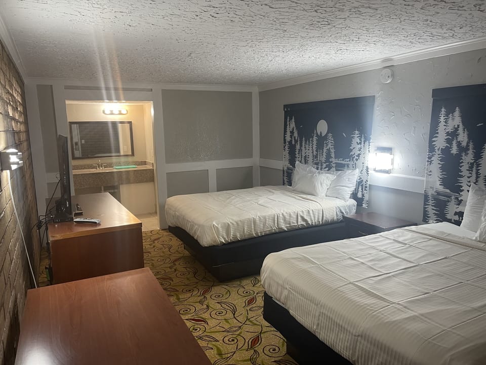 Standard Room, 2 Queen Beds, Non Smoking, Jetted Tub | Desk, blackout drapes, soundproofing, iron/ironing board