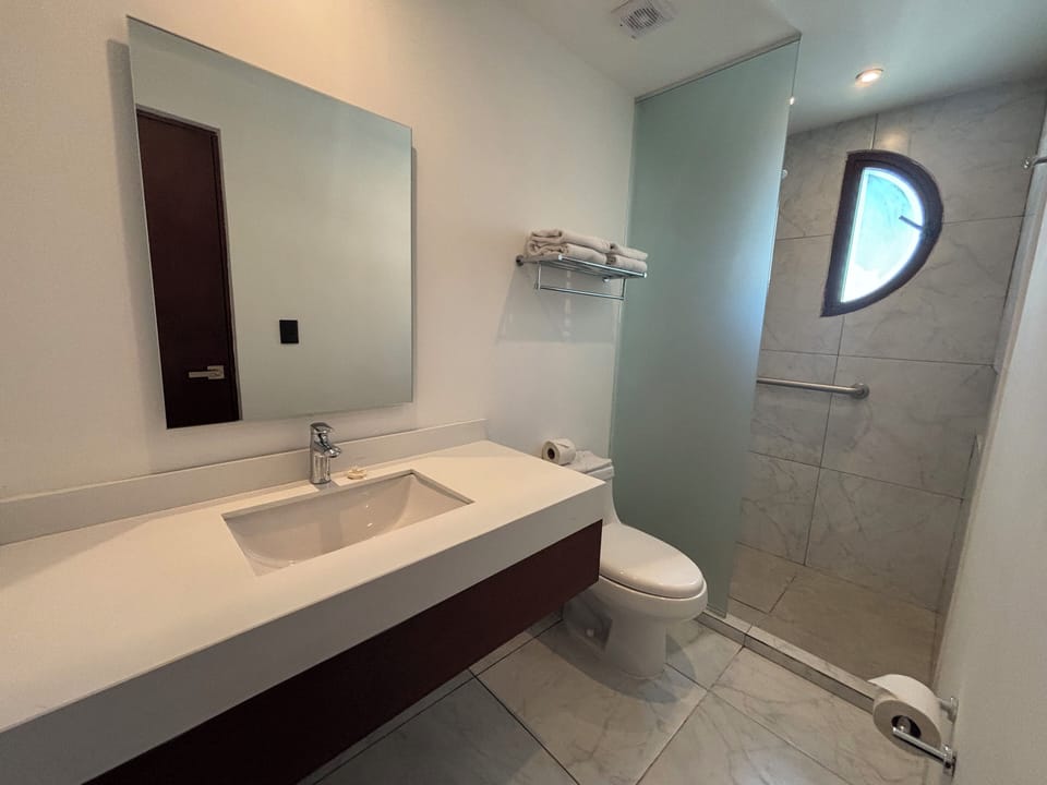 Shower, eco-friendly toiletries, hair dryer (on request), towels