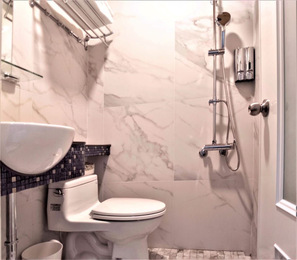 Shower, free toiletries, hair dryer, slippers