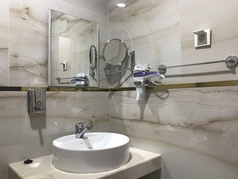 Shower, free toiletries, hair dryer, slippers