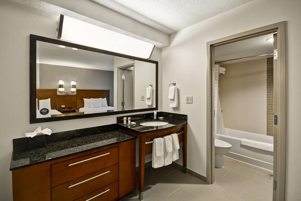 Designer toiletries, hair dryer, towels, soap