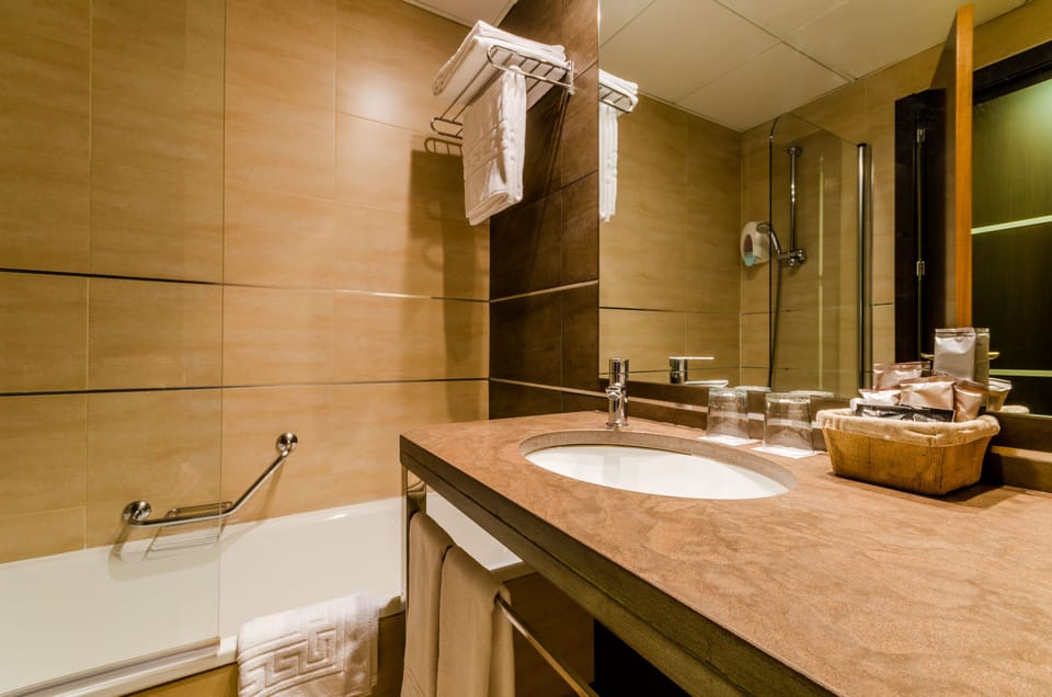 Eco-friendly toiletries, hair dryer, towels