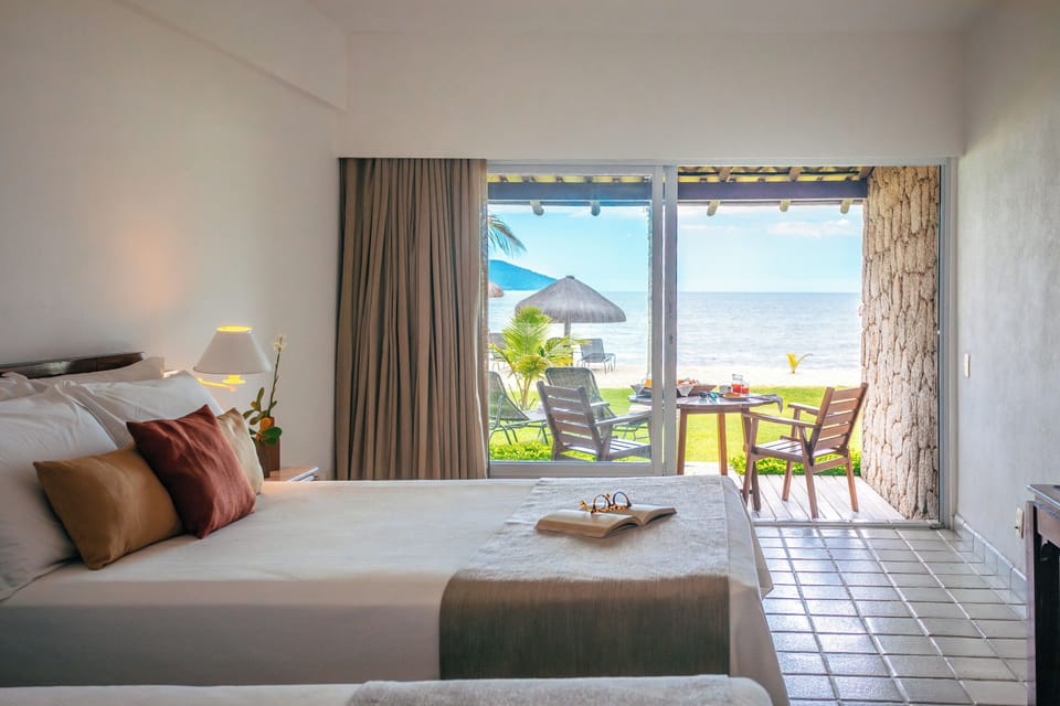 Room, Ground Floor (Beach Room) | Minibar, in-room safe, blackout drapes, free WiFi