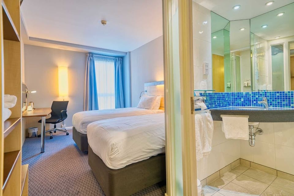 Desk, blackout drapes, iron/ironing board, free cribs/infant beds