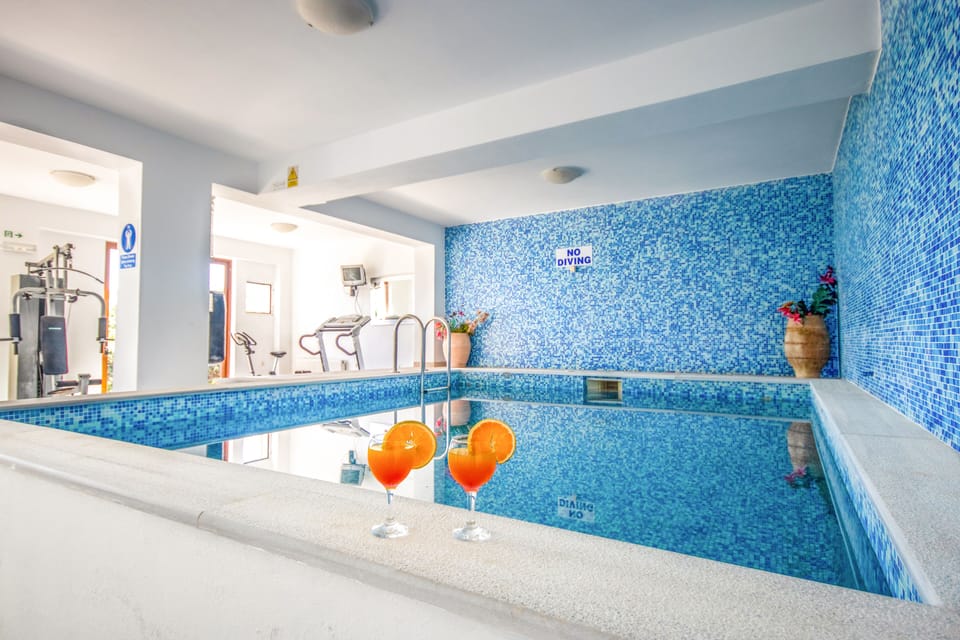 Indoor pool, outdoor pool, open open 24 hours, pool umbrellas