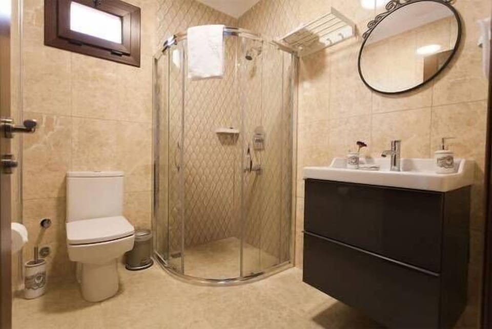 Shower, free toiletries, hair dryer, slippers