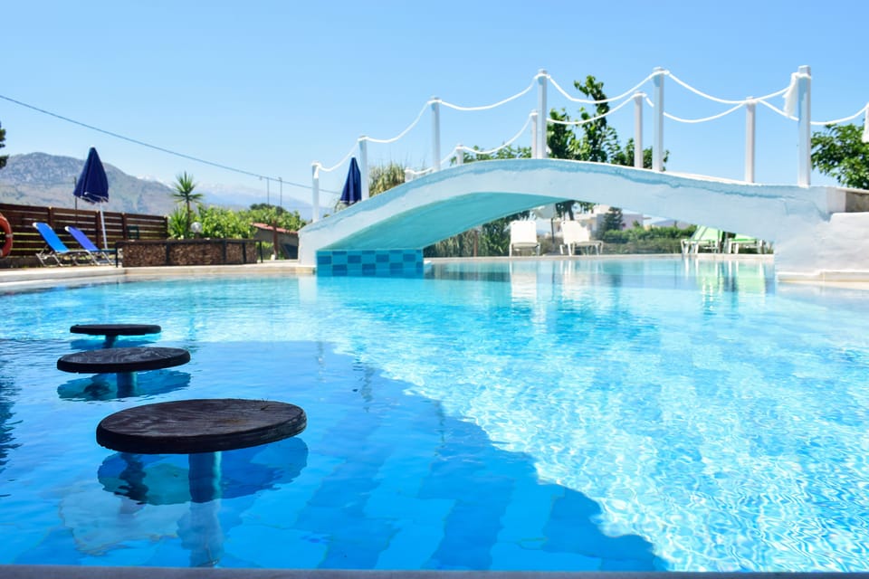 Outdoor pool, pool umbrellas, sun loungers