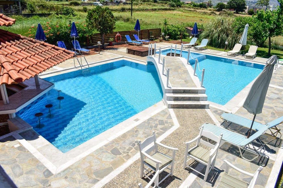 Outdoor pool, pool umbrellas, sun loungers