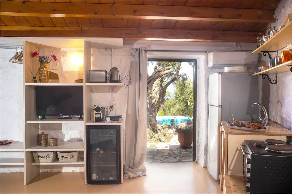 Apartment, 1 Bedroom, Private Pool, Sea View (Nostos) | Private kitchen | Stovetop, espresso maker, coffee/tea maker, electric kettle
