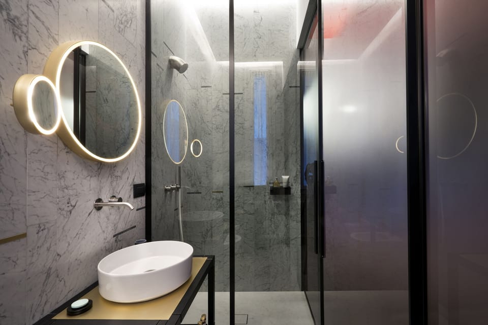 Shower, designer toiletries, hair dryer, bathrobes