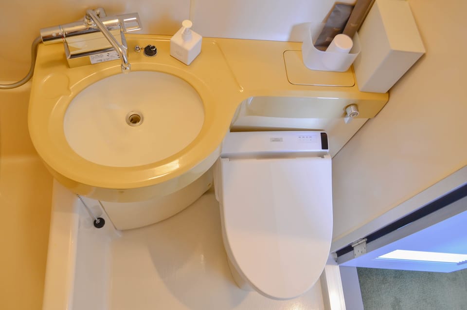 Combined shower/tub, free toiletries, hair dryer, slippers